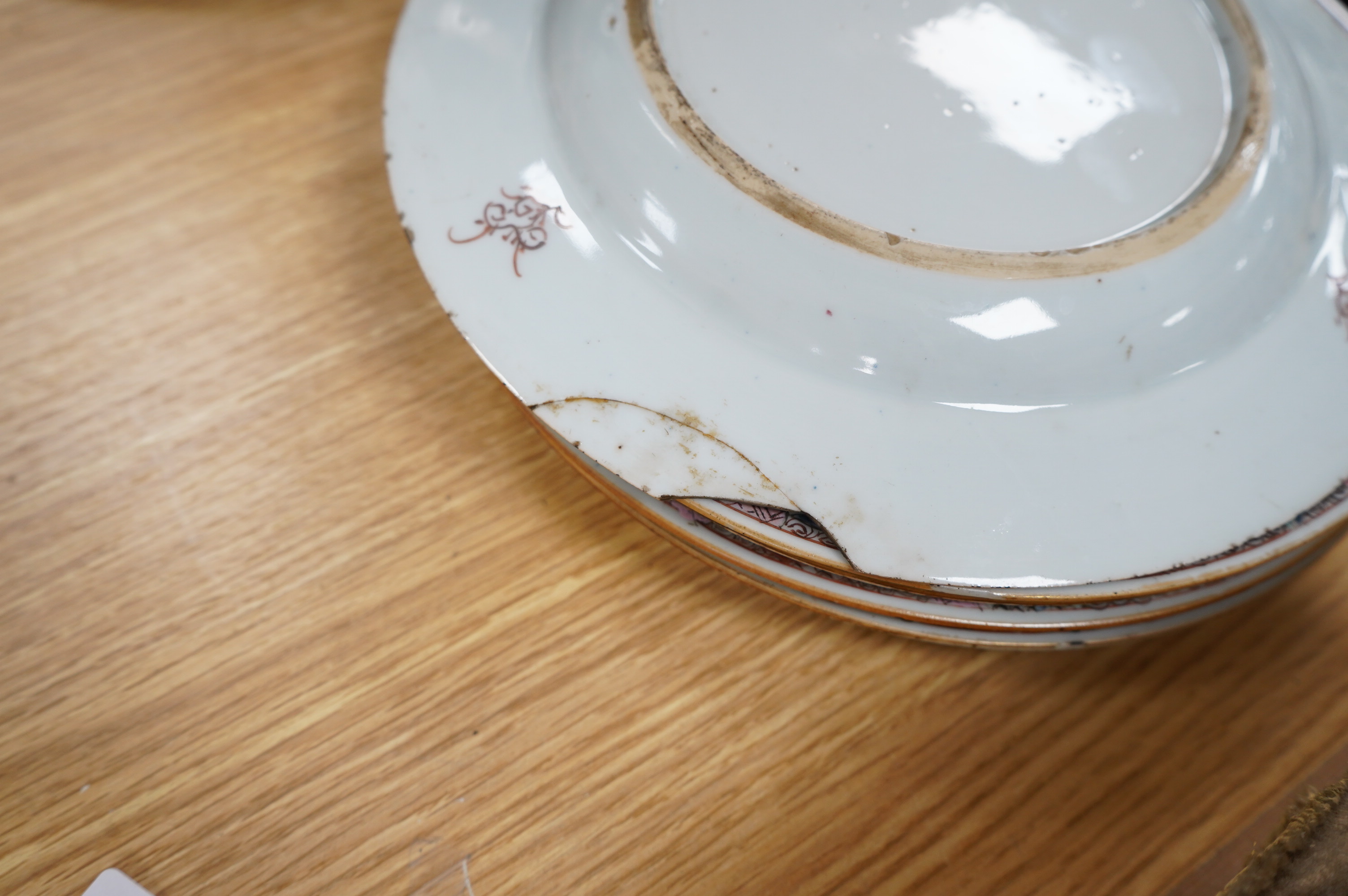 A set of five Chinese porcelain famille rose dishes, diameter 22.5cm, and three others (8). Condition - poor, significant damage to many.